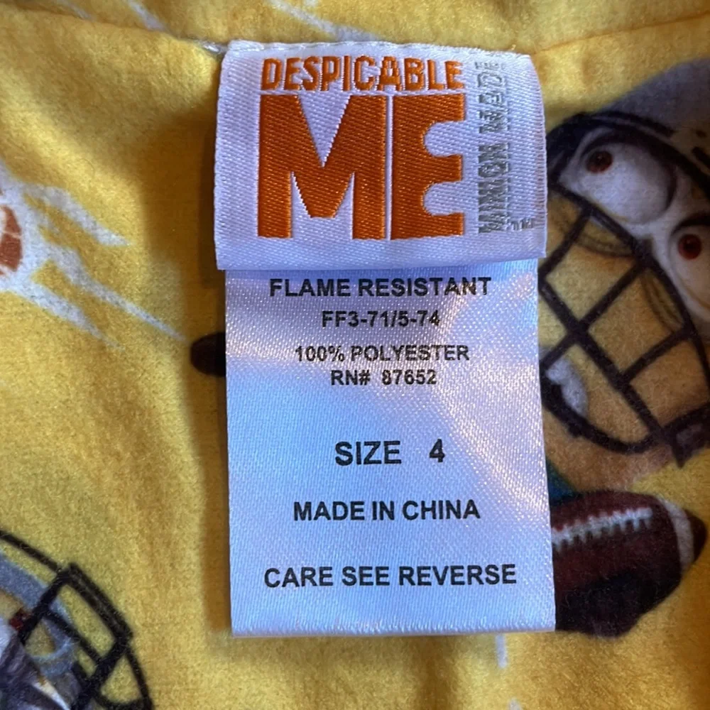 Minions yellow football pajama top & bottoms.  Size 4